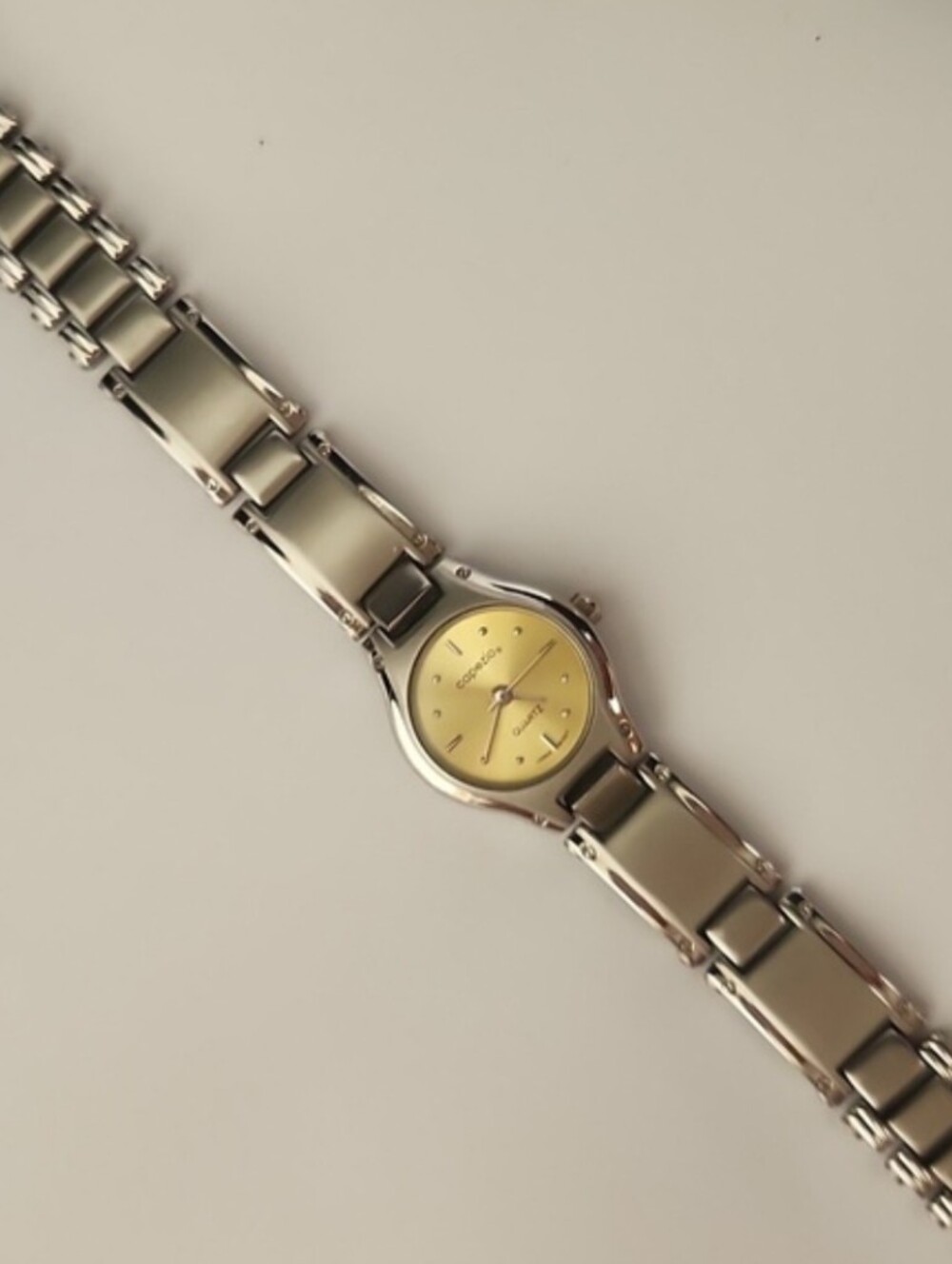 Capezio Watch With Gold Tone Face And Silver Tone Bracelet